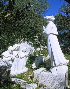 The apparition of the Angel to Lucia, Jacinta and Francisco.